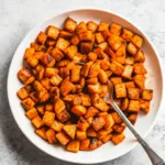 Savory Roasted Sweet Potatoes: Crispy, Herby & Ready in 30 Minutes Savory Roasted Sweet Potatoes Savory roasted sweet potatoes in a white bowl with crispy edges